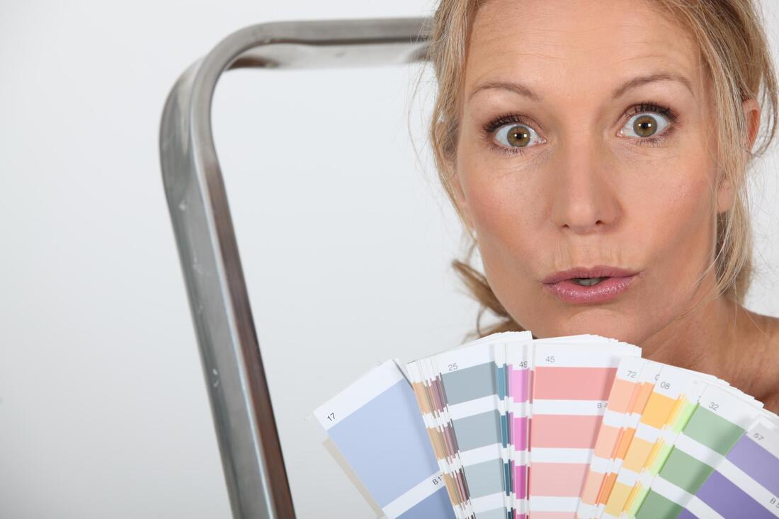 paint color consultant in Fredericton holding paint colors
